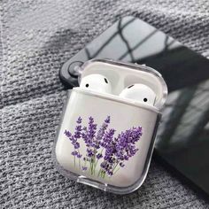 an airpods case with lavender flowers on it