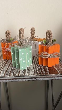 small boxes with twine tied to them sitting on a table