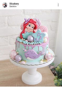 the little mermaid cake is decorated with fondant