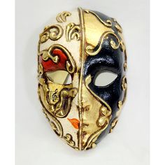 a gold and black mask on a white background