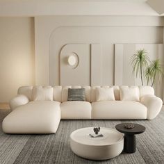 a large white couch sitting in a living room on top of a carpeted floor