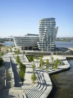 an architecturally designed building next to the water