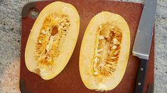 two pieces of squash on a cutting board with a knife