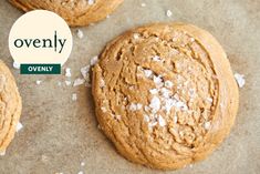 three cookies with coconut flakes on top and the words ovenly overlayed