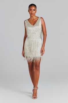 Sadie Silver Dress Women's Clothing > Dresses.     DESCRIPTION &  FEATURES  The SADIE SILVER is a real showstopper. I ndividually hand embellished with crystal waterfall beading, to  create a mesmerising illusion. A sachet of silver beaded fringing and sequins with flat beaded panelling on the waist to accentuate your curves and flatter your figure.  This eye catching mini is the perfect party dress or the ideal celebration dress for the bride to be.   -Hand embellished  -Flat sequin and beaded Celebration Dress, Nadine Merabi, Sadies Dress, Embellished Flats, New Years Dress, Fabulous Dresses, Beaded Fringe, Silver Dress, Celebrity Dresses