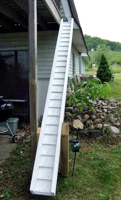 a ladder leaning up against a house