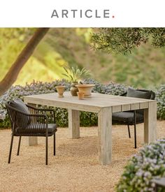 an outdoor table with chairs and potted plants