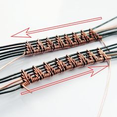 three different types of wires connected to each other on a white surface with red arrows pointing towards them