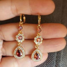 New 18k Gold Plated Pear Ruby Diamond Flower Dangle Drop Hoop Earrings For Women All Photos Are From The Actual Item No Stock Photo Used. Measurements Shown In The Pictures. All Items Comes With A Jewelry Box. Color May Slightly Differ Due To Lighting. All Gemstones Are Simulated. Please Feel Free To Ask Any Question About The Item. Please Check Out My Other Jewelry. Gold Teardrop Flower Earrings, Aesthetic Watches, Earring Inspo, Faberge Jewelry, Pink Stud Earrings, Arabic Henna, Vintage Gold Earrings, Carnelian Earrings, Gold Jewellry