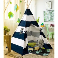 a child's teepee tent with blue and white stripes