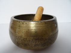 "At Temple Sounds we work with individuals all over the Himalayas to ethically source the best antique and new singing bowls we can.  Mani singing bowls also sometimes also known as mudra, elephants foot bowls, and Buddha begging bowls. These rare singing bowls have thick walls, flat bottoms and are wider in the middle than at the bottom or lip. Their inward slope is that of the classic begging bowl though they are much larger. Decorative markings are standard lines and concentric circles, though often faint due to wear. Mani singing bowls generally are dated from the late 16th to the 19th century. There are no new Mani bowls.  Despite their size Mani bowls tend to be very high in frequency. It is quite rare to find a Mani that is as low as the upper range of the middle octave, which is a Tibetan Bowls Therapy, Tibetan Bowl, Golden Bowl, Crystal Singing Bowls, Crystal Tones Singing Bowls, Sound Meditation, Healing Therapy, Tibetan Singing Bowls, Singing Bowls