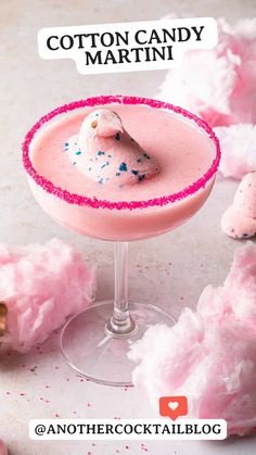 two cocktails with marshmallow and pink frosting on the rim, next to cotton balls