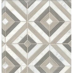 a white and grey tile wall with an abstract design