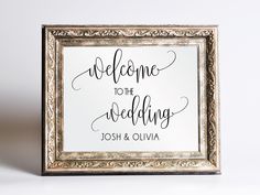 a framed sign that says welcome to the wedding joshua and olvia in cursive writing