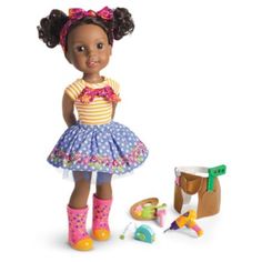 the doll is wearing a dress and boots