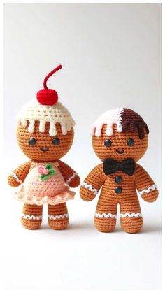 two small crocheted gingerbread men and woman dolls, one with a cherry on top