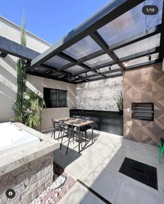 an outdoor kitchen and dining area is shown in this 3d image with no people around