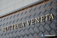 bottega veneta sign on the side of a building