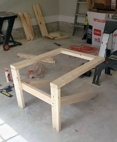 a table being built in a room with construction tools