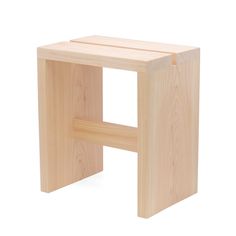 a small wooden stool sitting on top of a white floor