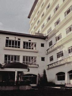 an old building with many windows and balconies