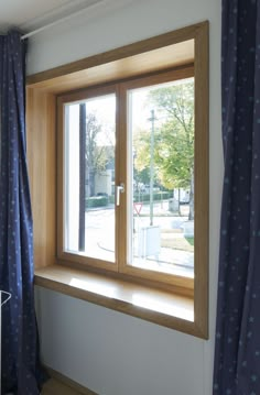 an open window with blue stars on the curtains