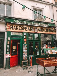 shakespeare and company on the corner of a street in paris, france with tables outside