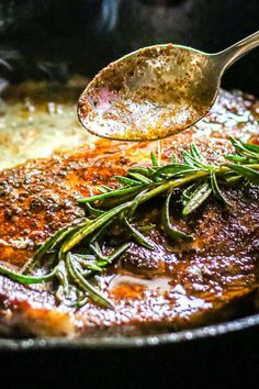 pan seared steak with rosemary being spooned into the skillet and text overlay reads quick & easy pan seared steak