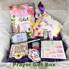 a gift box filled with cards, tags and other items for someone's special occasion