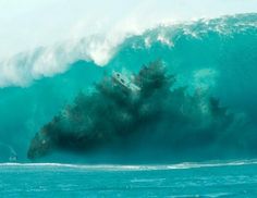 a large wave is crashing over the top of a boat in the ocean with trees growing out of it