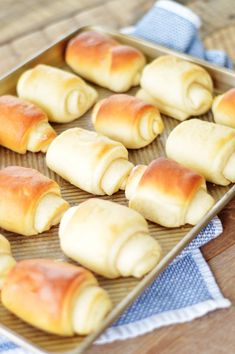 some bread rolls are sitting on a baking sheet and ready to be baked in the oven