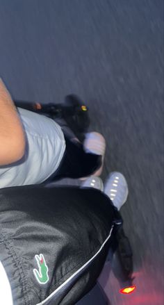 a man riding on the back of a scooter