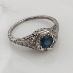 Details: Stunning Art Deco Period platinum and sapphire ring--would make a lovely wedding ring! The center stone is estimated .40 carats, and measures 4.9mm round. The filigree is beautiful on this ring, and is in lovely shape. This is a stunning ring--you will not be disappointed! Please ask all necessary questions prior to placing an order. Measurements: The size is 5 1/2 US and can be sized for a fee. Condition: The overall all condition of this ring is very good. Brilliant Cut Sapphire Diamond Ring In Platinum, Classic Platinum Gemstone Ring, Classic Sapphire Halo Ring, Timeless Sapphire Solitaire Promise Ring, Classic Sapphire Ring In 14k White Gold, Sapphire Diamond Ring With Brilliant Cut In Platinum, Diamond Ring With Brilliant Cut Sapphire In Round Shape, Sapphire Diamond Ring With Brilliant Cut, Platinum Sapphire Diamond Ring With Brilliant Cut