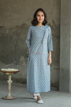 This subtle color combination goes smooth on the eyes. This kurta comes with one side pockets Ikat Kurti Designs, Ikkat Kurta Designs, Kurta Women, Kurta Patterns, Simple Kurti Designs