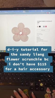 a laptop computer sitting on top of a table with an ad on the screen that says diy - tutor for the sandy tang flower scrunche bc i don't have $ 15 for a hair accessory