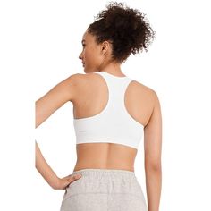 The Jockey Seamfree Mid Impact Sports Bra delivers stretchy softness for total comfort before, during and after your workout. Made with at least 62% recycled nylon in a smooth, Seamfree design, this sweat-wicking phenom features a ribbed underbust band for comfortable support during medium-impact activities. Finished with removable cups for customizable shaping and coverage, and a racerback design for superb range of motion, this Jockey sports bra is your go-to favorite for the gym and beyond. Supportive Solid Activewear For Sports, Supportive Solid Color Activewear For Sports, Solid Sweat-resistant Activewear For Sports Season, Go-dry Elastane Sports Bra, Solid Activewear For Light Sports With Light Support, Solid Color Activewear For Light Sports, Sporty Solid Color Activewear With Light Support, Supportive Solid Nylon Activewear, Supportive Stretch Activewear For Light Sports