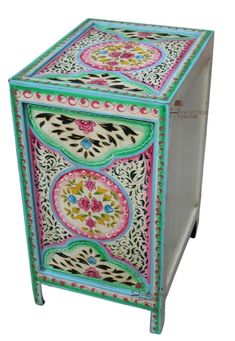 an artisticly painted wooden box on wheels