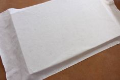 a piece of white paper sitting on top of a table