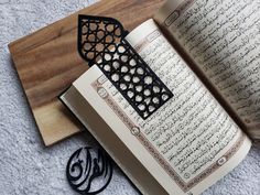 an open book sitting on top of a wooden table