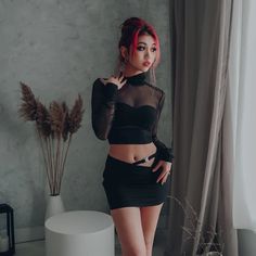 This simple and plain black micro skirt is designed with comfort and protection in mind, featuring hidden shorts underneath. Women's Streetwear Fashion, Turtleneck Crop Top, Mesh Turtleneck, Turtle Neck Crop Top, Micro Skirt, Asymmetrical Tops, Edgy Look, Black Mini Skirt, Plain Black