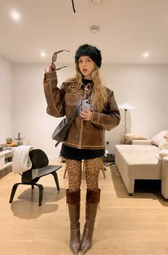 Cheetah Hat Outfit, Outfits With Brown Knee Boots, Mini Skirt High Boots Outfit, Distressed Boots Outfit, Y2k Knee High Boots Outfit, Cheetah Tights Outfit, Tights And Skirt Outfit Winter, Boots And Mini Skirts Outfits, Cheetah Print Mini Skirt Outfit