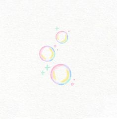 two soap bubbles floating in the air on a white paper background with pastel colors