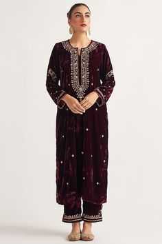 Featuring a wine kurta in velvet base with hand embroidery. It is paired with matching palazzo pants. This product will be shipped to you after 1-2 weeks from the date of order placed. All custom made orders are not returnable. Pls contact for Size chart and for other more colors Request You :To provide contact details for courier services. {VARIATION MAY COME DEPENDING UPON AVALIBILITY OF LACES OR GOTTA PATI or TUSSELS} NOTE:  1) Visual Samples on website may differ slightly from actual product due to light & effects during photography (Length & Breadth have 1 n 1.5 inches +/-). 2) Before placing order ,pls confirm product n color availability and  For Wholesale Order MOQ is 5 Pieces of any color/Pattern on +91 7903893945 & +91 8447750028(WhatsApp) Bridal lehanga ,indian wedding,Canada we Velvet Suit Design, Velvet Outfit, Velvet Kurta, Velvet Embroidery, Velvet Dress Designs, Independance Day, Pant For Women, Velvet Suit, Embroidered Pants