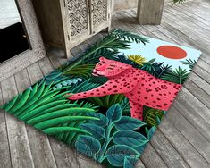 a rug with a pink cheetah in the jungle