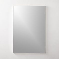 a mirror mounted to the side of a wall