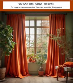 an orange curtain in front of a window with potted plants