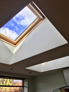 a room with a skylight in the ceiling