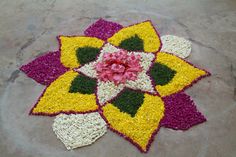 an image of a flower made out of crochet on the ground with flowers