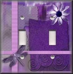 two light switch plates with purple and white designs on the front, one has a flower