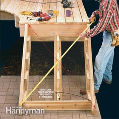 a man is measuring the height of a table with a tape measurer and tools